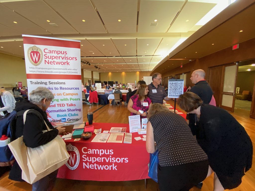Planners Chris and Rich interacting with visitors to our booth at the Employee Benefits and Resource Fair.