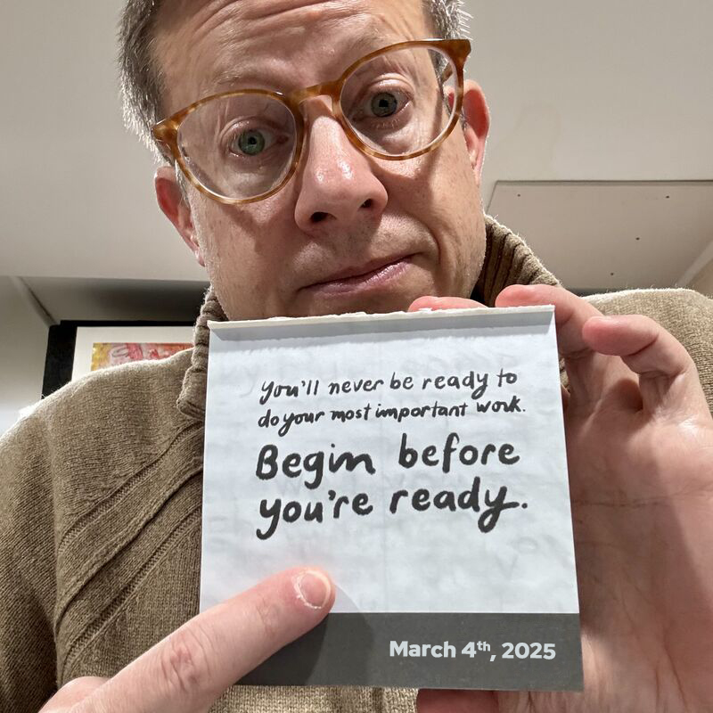 Mordy Golding holding a day-at-a-glance calendar page that says: You’ll never be ready to do your most important work. Begin before you’re ready. March 4th, 2025