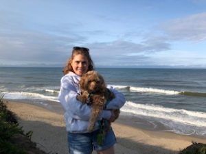Catherine Auger with dog on the beach