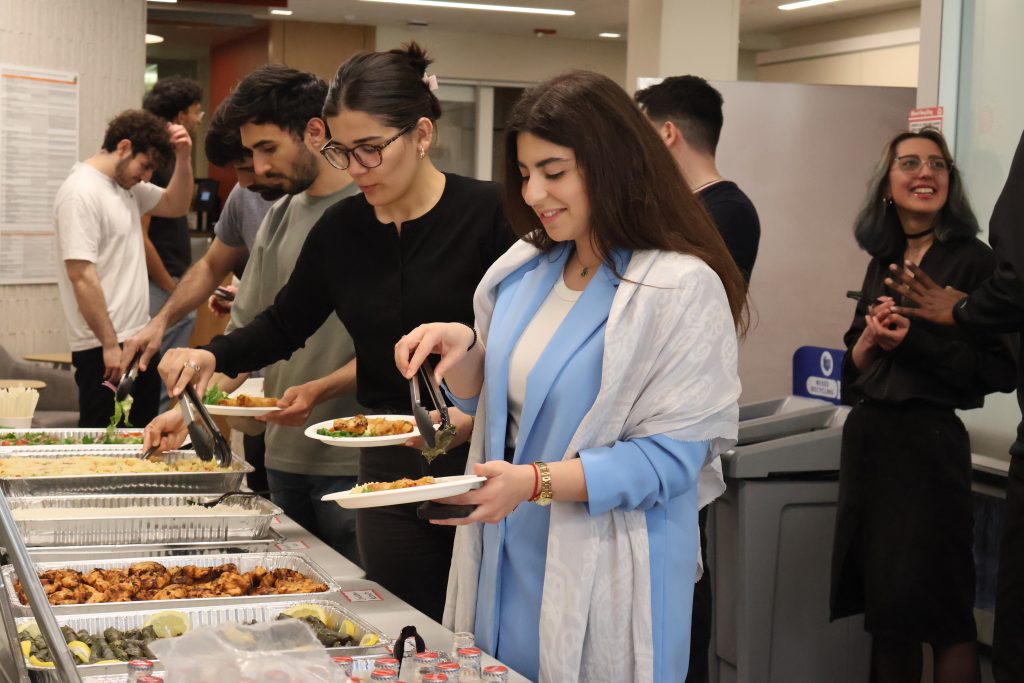 Students serve themselves food at Global Cafe hosted by the Azerbaijani Student Association.