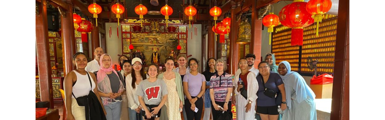 2023 Global Gateway students pose beneath paper lanterns in Singapore