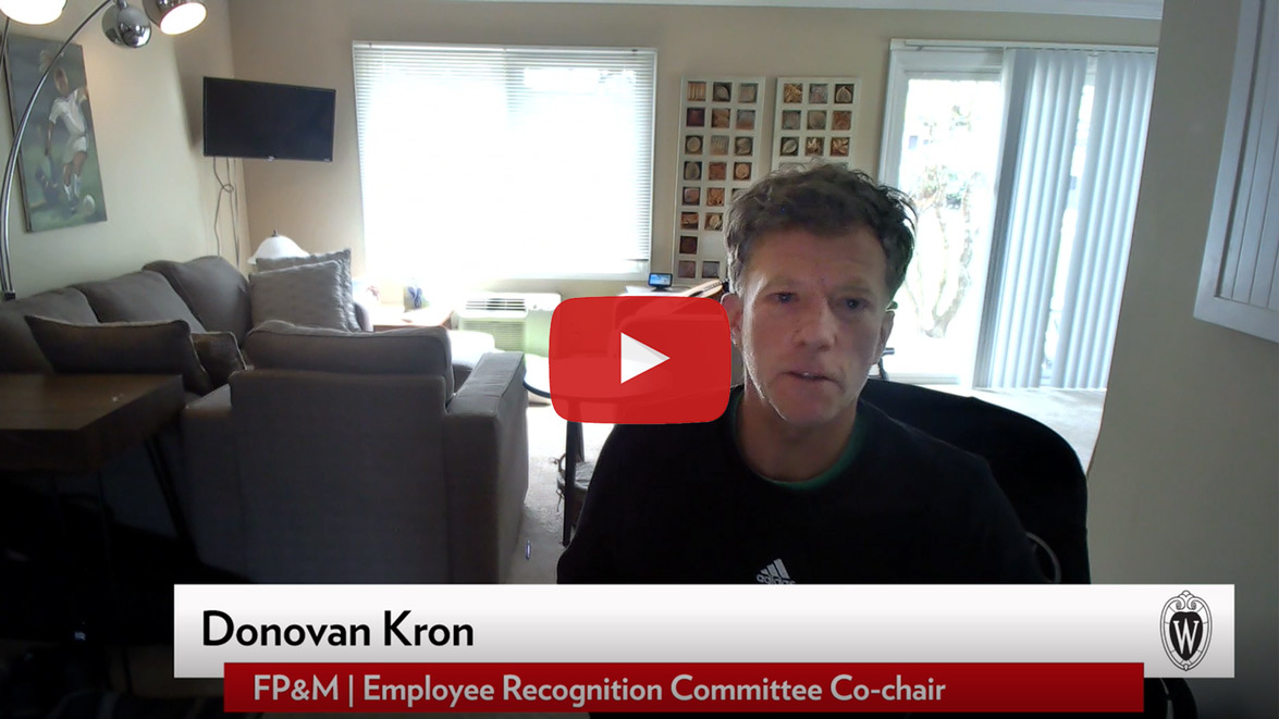 video player: Donovan Kron is seated at home office speaking. Video play button. "Donovan Kron, FP&M Employee Recognition Committee"