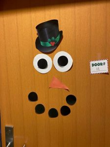 *Snowman face decoration on door*