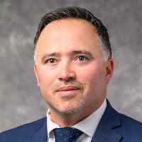 Studio portrait of Raul Leon, assistant vice provost for student engagement and scholarship programs in the Division for Teaching and Learning at University of Wisconsin–Madison
