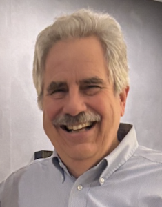 Formal headshot of Bob Mathieu