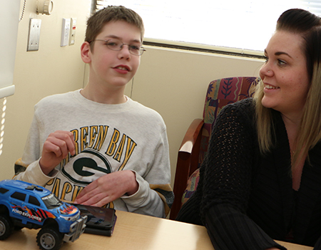 Young Man with Autism and Mom at Clinic