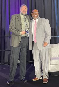 Tim Markle and Marcus Allen (right)