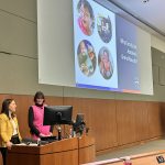Danielle Gerber and Cara Coleman giving a presentation
