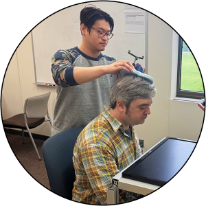 An NMS user piloting his TMS protocol with a lab member