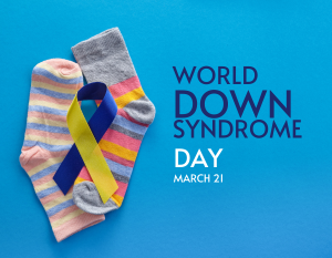 Image says World Down Syndrome Day, March 21st over a blue background with two colorful socks next to the text